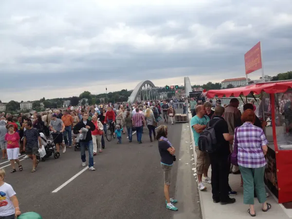 Dresdeners gather at a festival on a bridge