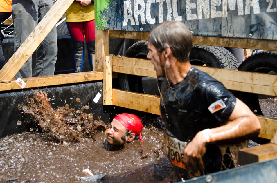 Avinash and Jeff in a pool full of mud and ice