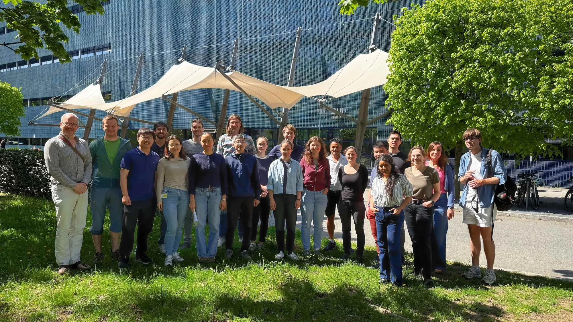 The Hyman lab members smile in front of MPI-CBG