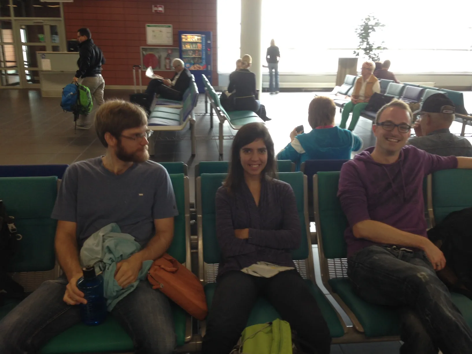 Three lab members waiting at the airport